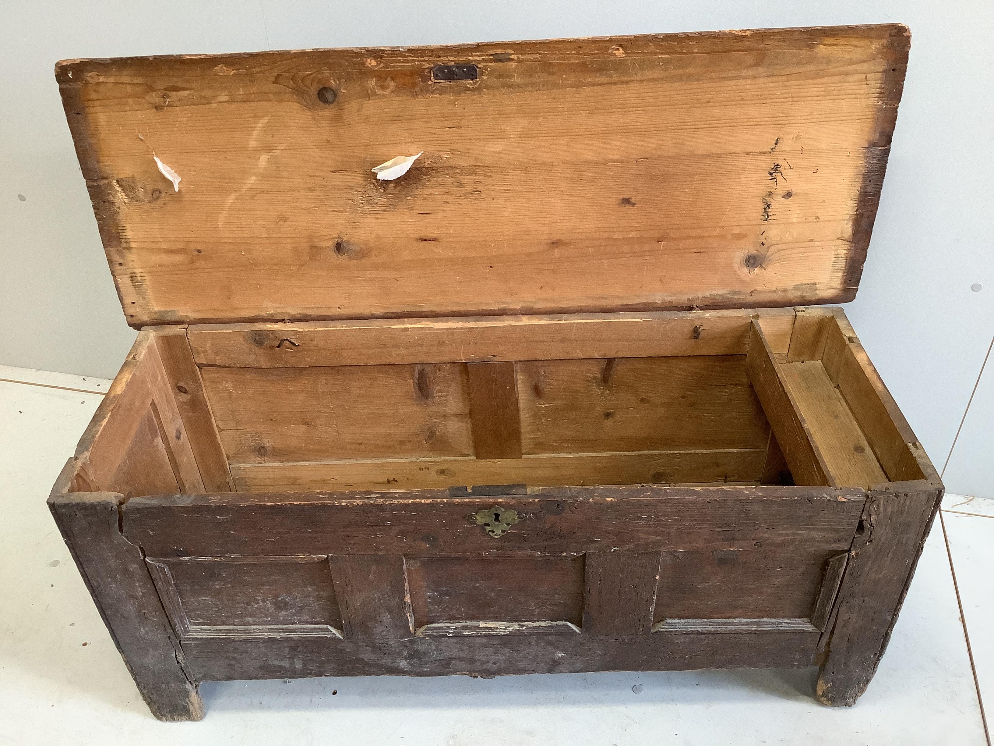 An 18th century panelled pine coffer, width 112cm, depth 41cm, height 50cm